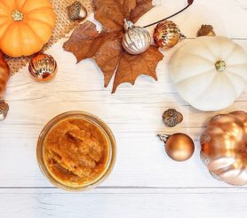 Picture of some fall decor and a jar of pumpkin spice face mask.