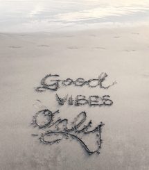 Good Vibes only written in beach sand